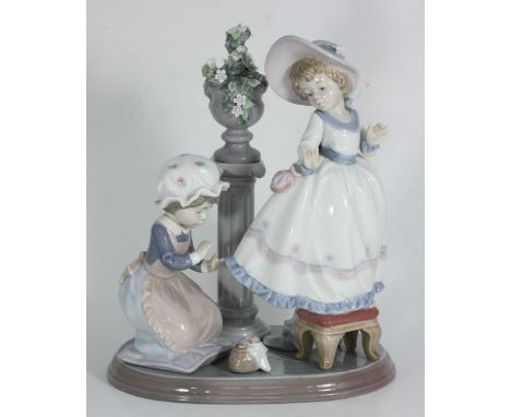A boxed Lladro porcelain figure 'A Stitch in Time' no.5344, 19cm long.