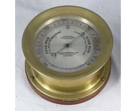 A brass-cased aneroid barometer by H. Hughes &amp; Sons, Fenchurch St, London, 'Improved Marine Aneroid Compensated, silvered