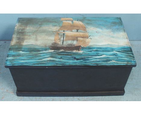 A wooden trunk, the hinged cover decorated with a fully-rigged, two masted ship with single gun deck. 79cm wide.