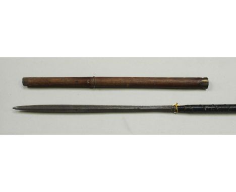 An Indonesian pole arm, with 52cm long slender Pamor blade with original brass-mounted wooden scabbard, the haft with black-c