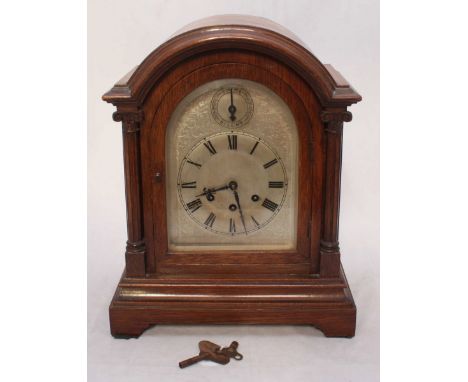 An early 20th century oak cased bracket clock by Gustav Becker, the silvered dial with Roman numerals denoting hours and with