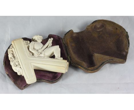 A Meerschaum pipe carved with a seated hunter with gun, in original fitted case, 7cm high
