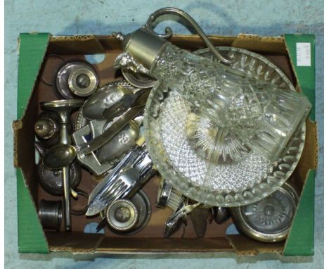 A silver napkin ring and a small silver candlestick, together with a quantity of silver-plated items including condiments, fl