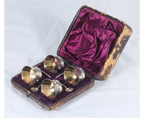 A boxed four-piece set of Victorian silver open salts and spoons by Cornelius Desormeaux Saunders &amp; James Francis Holling