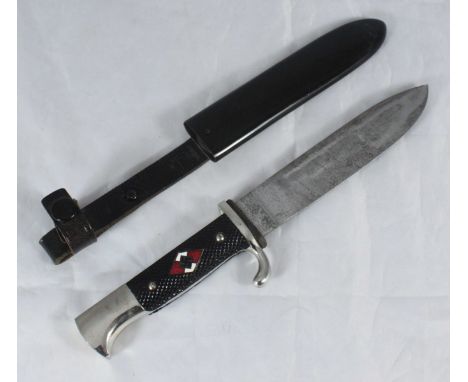 A WW2 Third Reich Hitler Youth dagger with enamelled insignia to chequered grip, the blade marked 'Original Eickhorn, Solinge