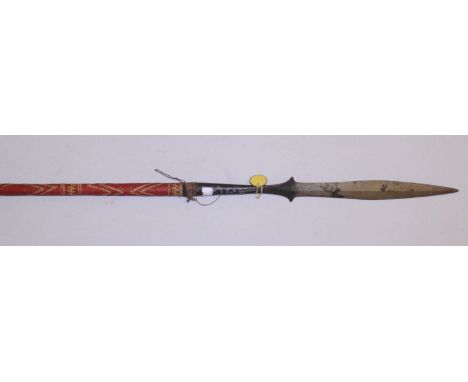 An early 20th century North African hunting spear, with elongated 48cm wrought iron blade and socket, and 33cm pointed shoe-p