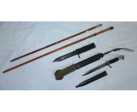 Two assorted swagger sticks, one with silver handle by J R Gaunt &amp; Son, Birmingham, together with a modern bayonet with r