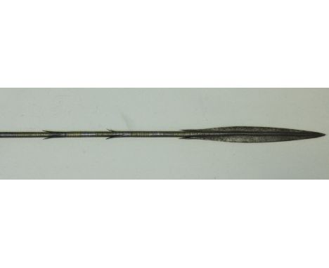 An all iron hand-forged Maasai lion hunting spear, the blade of crucifom section with two integral barbs and a further four b