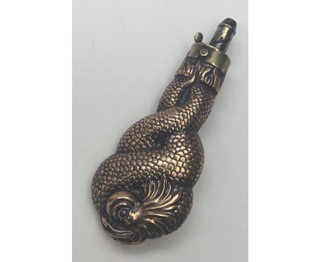 A rare 19th century entwined dolphins powder flask. Copper body depicting stylised dolphins, intertwined. Brass top with nozz