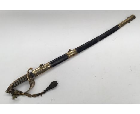 A British 19th century 1827 pattern Royal Navy Officers Sword. Brass fold down guard, with fouled anchor and Queen’s crown in