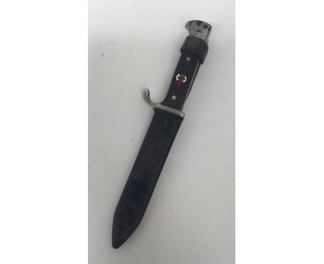 An early 1st type German Hitler youth knife with associated scabbard. Standard nickel plated pommel and cross guard, cross ha