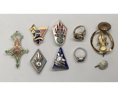 A selection of post WW2 French Foreign Legion badges (several by Drago, Pairs),buttons, and rings. To include: a sterling sil