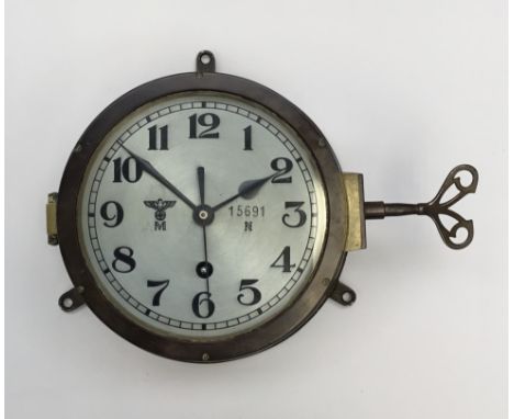 A WW2 German Kriegsmarine bulkhead clock, by repute taken from the Prinz Eugen after being surrendered to the British Royal N