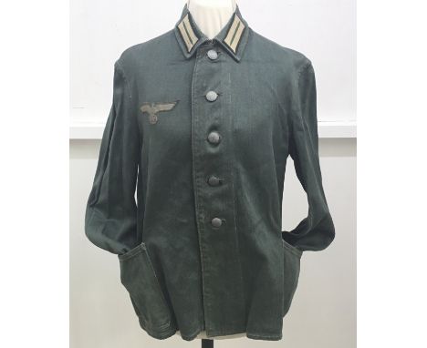A WW2 era German enlisted man’s / NCO’s work jacket / shirt. Made in green cotton HBT fabric, with applied BeVo style eagle t