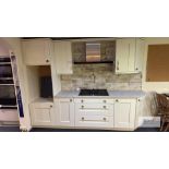 Display Kitchen with Cream Base Units & Two Wall Mounted Units with Quartz Work Top.
