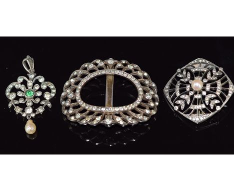 A silver brooch set with paste and a pearl, a pendant set with faux emerald paste and a drop pearl and a French&nbsp;silver b