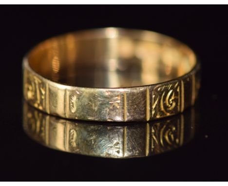 An 18ct gold wedding band/ ring with engraved panel decoration, Birmingham 1868, 2.7g, size Q&nbsp;