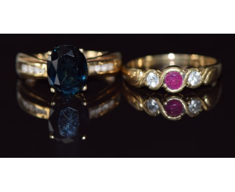 Two 9ct gold rings, one set with a ruby and cubic zirconia the other a sapphire and cubic zirconia, 6g, size N