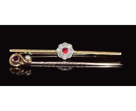 A c1925 15ct gold brooch set with a round cut spinel and diamonds in a platinum setting together with a 15ct gold stick pin s