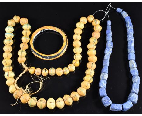 A single strand of lapis lazuli beads, a strand of Venetian yellow glass&nbsp;bicone trade beads and a glass bangle&nbsp;