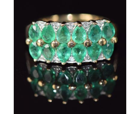A 9ct gold ring set with pear cut emeralds and diamonds, 3.5g, size J