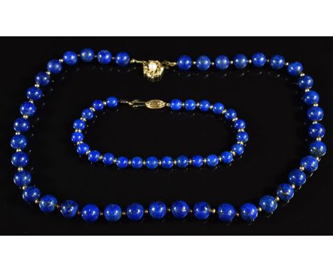 A necklace of lapis lazuli beads interspersed with gold beads, the 9ct gold clasp set with a pearl, with similar bracelet, 43