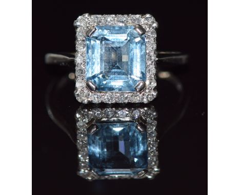Art Deco platinum ring set with an emerald cut aquamarine of approximately 2.4ct surrounded by diamonds, 4.4g, size M/N