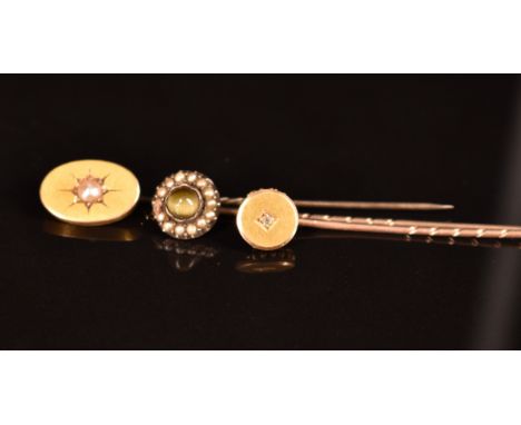 Three Victorian stick pins, one set with a split pearl, one a diamond and the other chrysoberyl and seed pearls&nbsp;