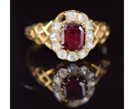 Victorian&nbsp;18ct gold ring set with an emerald cut garnet and rose cut diamonds, 2.9g, size K