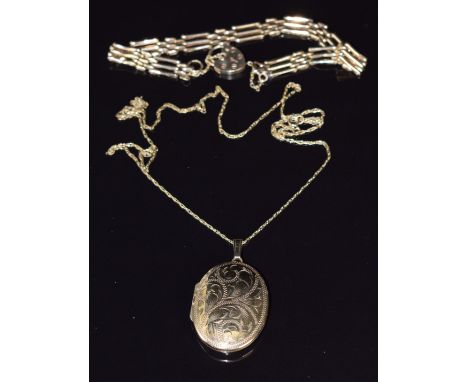 A 9ct gold locket and chain and 9ct gold gate bracelet, 11.3g