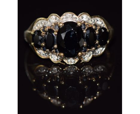 A 9ct gold ring set with sapphires and diamonds, 4.2g, size N