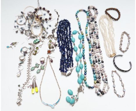 A collection of jewellery including silver necklaces, pearl necklaces, silver rings, silver earrings, moonstone bracelet, etc