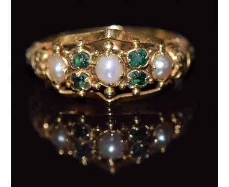 Victorian gold ring set with split pearls and tourmaline with embossed decoration to the shoulders, 2g, size K