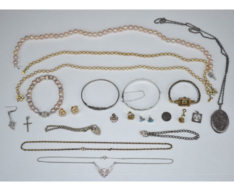 A collection of silver jewellery including two bangles, locket, necklaces, silver bracelets and a pearl necklace, etc