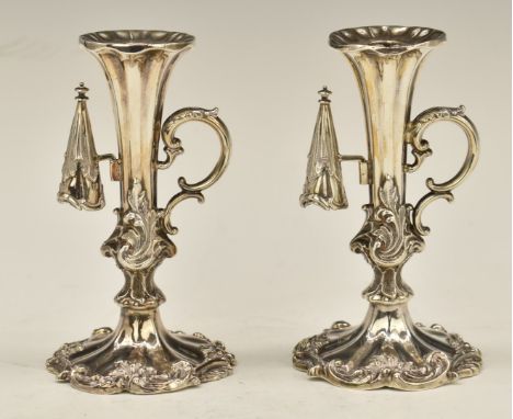 Pair of Victorian hallmarked silver chamber or candlesticks with scrolling handles and attached snuffer, Sheffield 1850 and 1