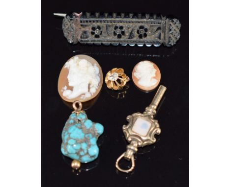 Victorian watch key, carved jet brooch, cameo signed to back, section of gold stick pin set with a pear cut diamond, and a tu