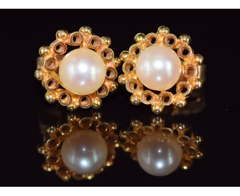 A pair of 18ct gold earrings set with a pearl to each, 2g