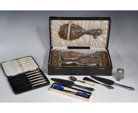 Cased hallmarked silver mounted dressing table set comprising hand mirror, comb and four brushes, cased set of hallmarked sil