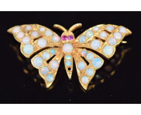 A 9ct gold butterfly brooch set with opals and ruby eyes, 5.5g, 4 x 1.8cm