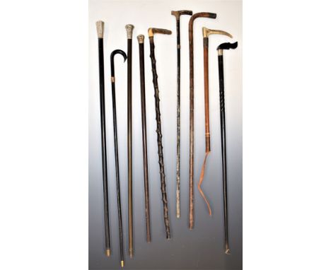Eight vintage walking sticks including 9ct gold collared example, four with hallmarked silver collars or tops including a nov