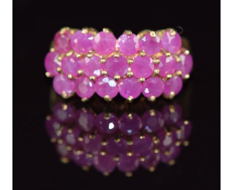 A 9ct gold ring set with three rows of rubies, 3.5g, size J