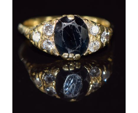 A 9ct gold ring set with a sapphire and diamonds, 4.6g, size P