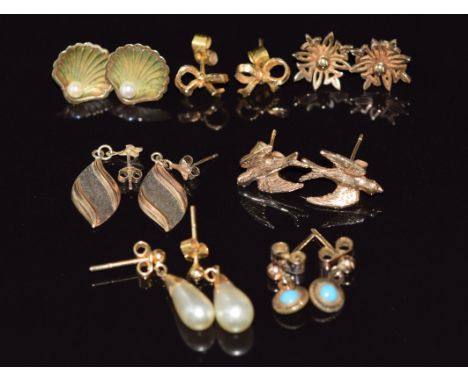 Six pairs of 9ct gold earrings including swallows, shells set with pearls, bows, etc (8.9g) and a pair of 9ct gold earrings s