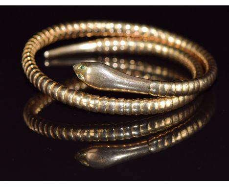 A 9ct gold serpent bangle with glass eyes, 17.2g