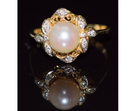 An 18k gold ring set with a pearl and diamonds in a pierced setting, 3.2g, size L