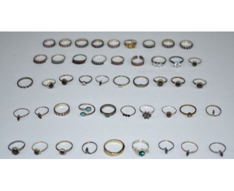 A collection of silver rings including sapphire, ruby, quartz, etc