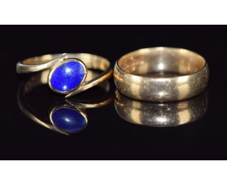 A 9ct gold ring set with lapis lazuli (size L) and a 9ct gold wedding band, size K/L, 5.1g