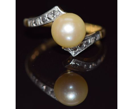 An 18ct gold ring set with a pearl and diamonds in a platinum setting, 3.9g, size N