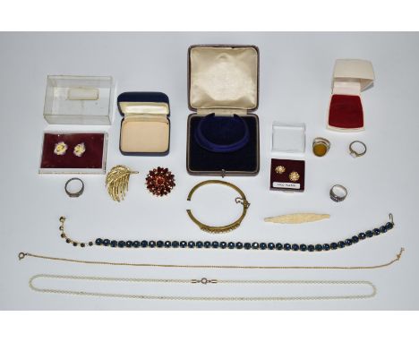 A collection of jewellery including three silver rings, rolled gold bangle set with opals, brooches, etc