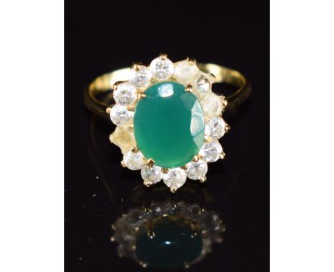 An 18ct gold ring set with paste